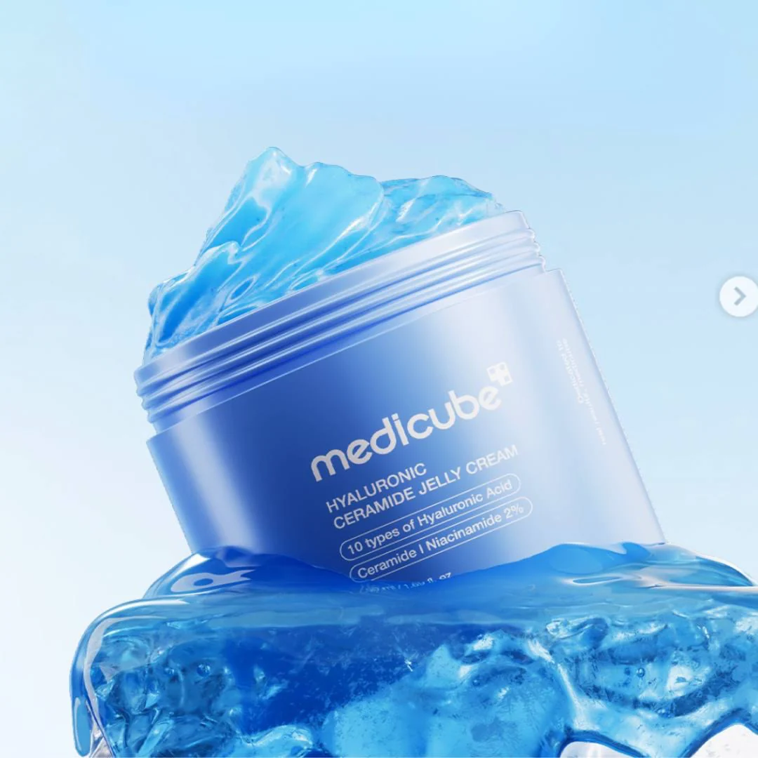 Blue jar of Medicube cream with blue jelly-like substance on a light blue background