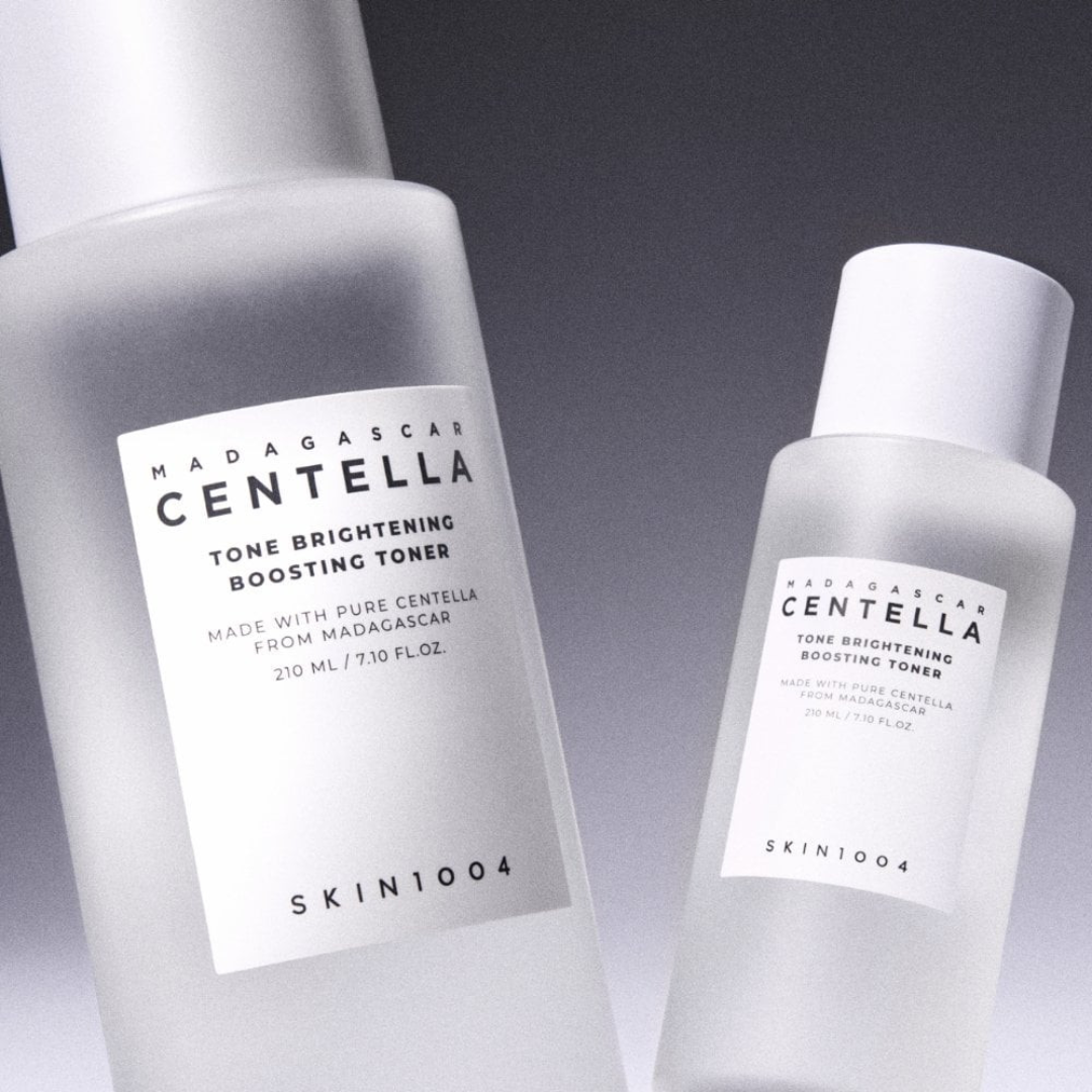 Two bottles of SKIN1004 Madagascan Centella toner on a gradient background