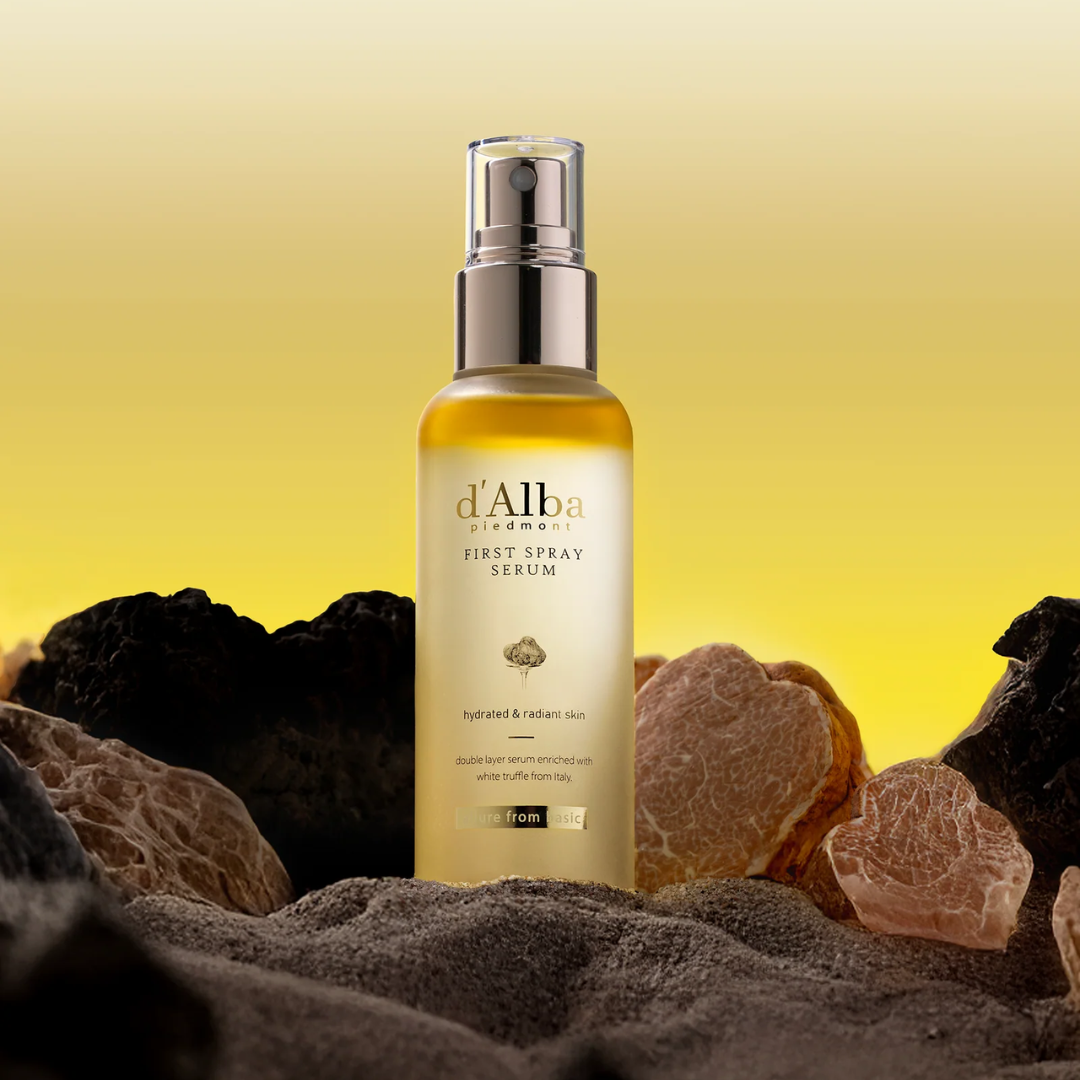 Spray serum bottle labeled 'd'Alba' with natural elements on a yellow background