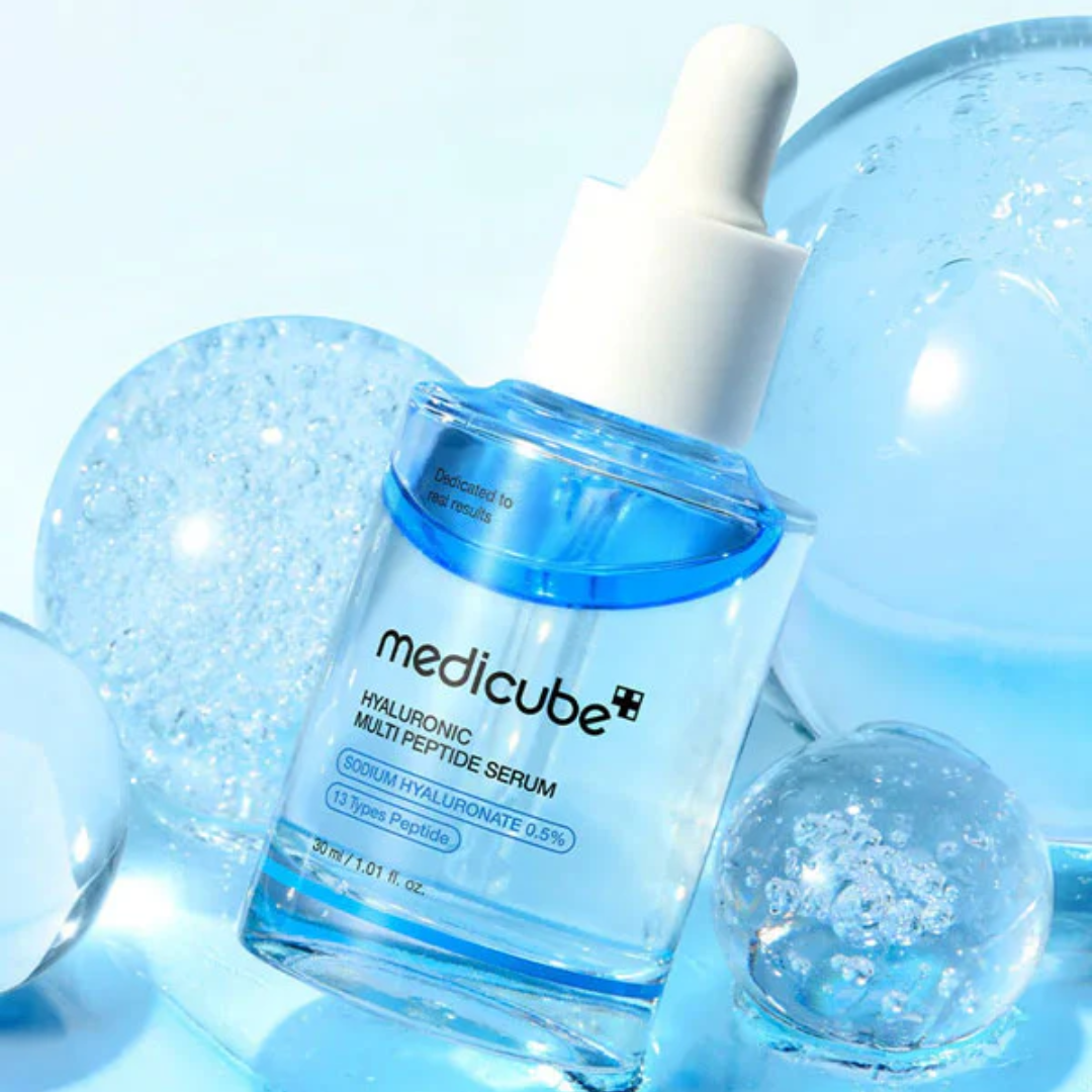 Medicube Hyaluronic Multi Peptide Serum bottle with dropper on a light blue background