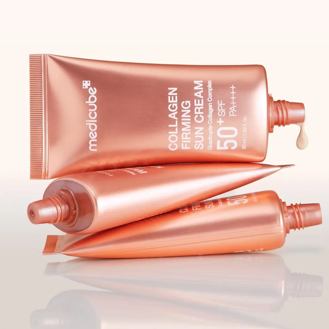 Two tubes of Medicube Collagen Firming Sun Cream on a white background