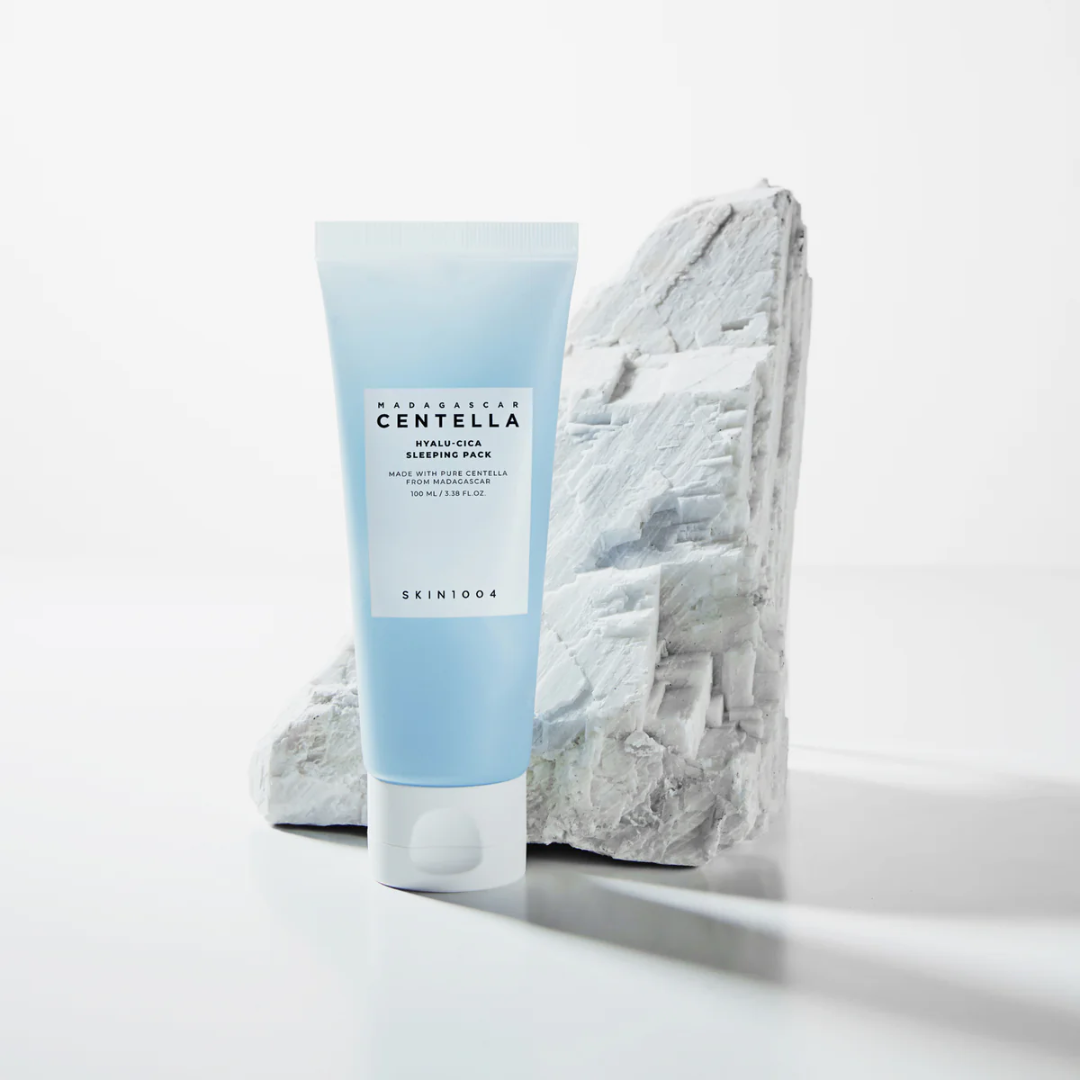 Skincare product with a blue tube labeled 'Naturalear Centella' on a light gray background.