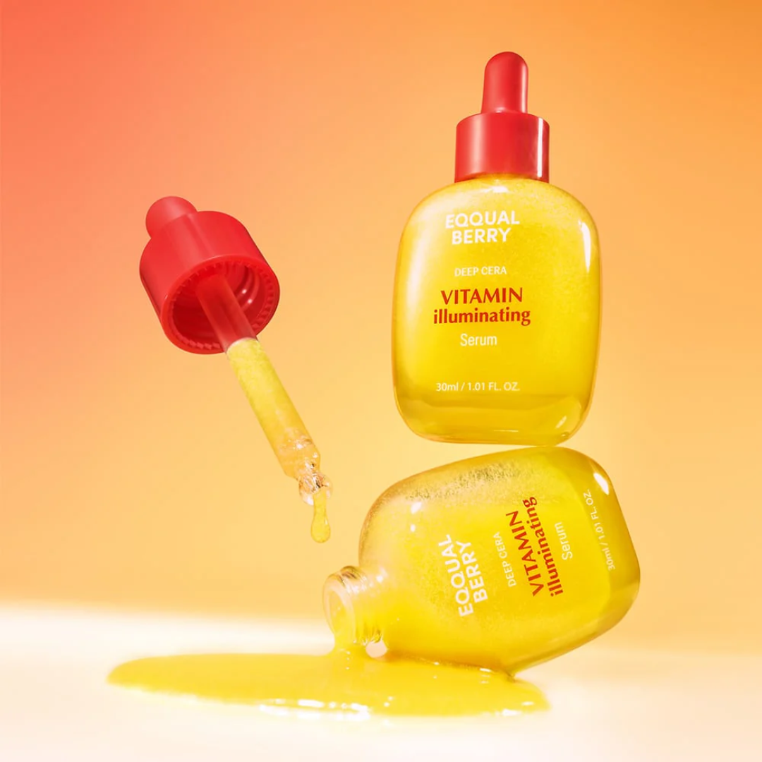 Yellow serum bottle with red cap on an orange gradient background