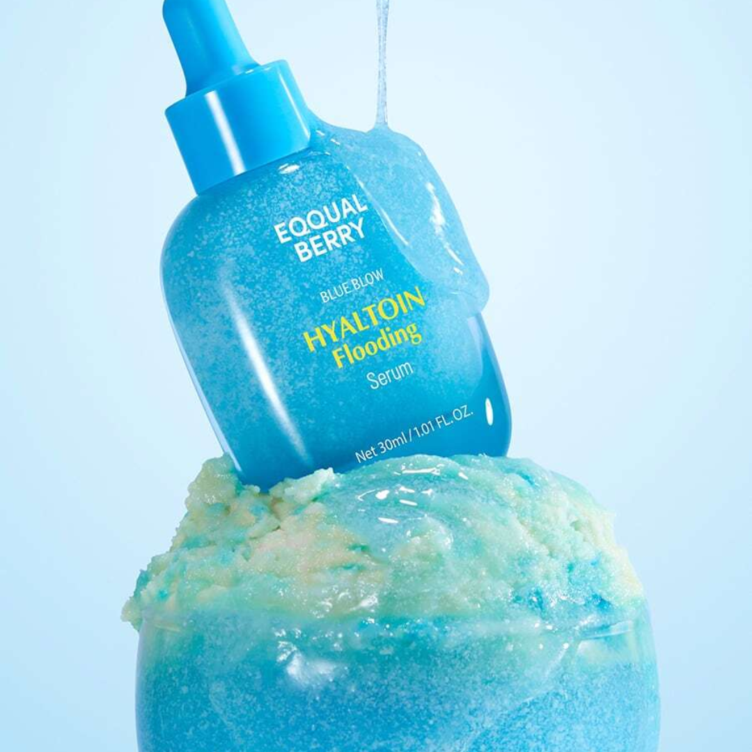 Blue serum bottle with dropper labeled 'Equal Berry' on a light blue background