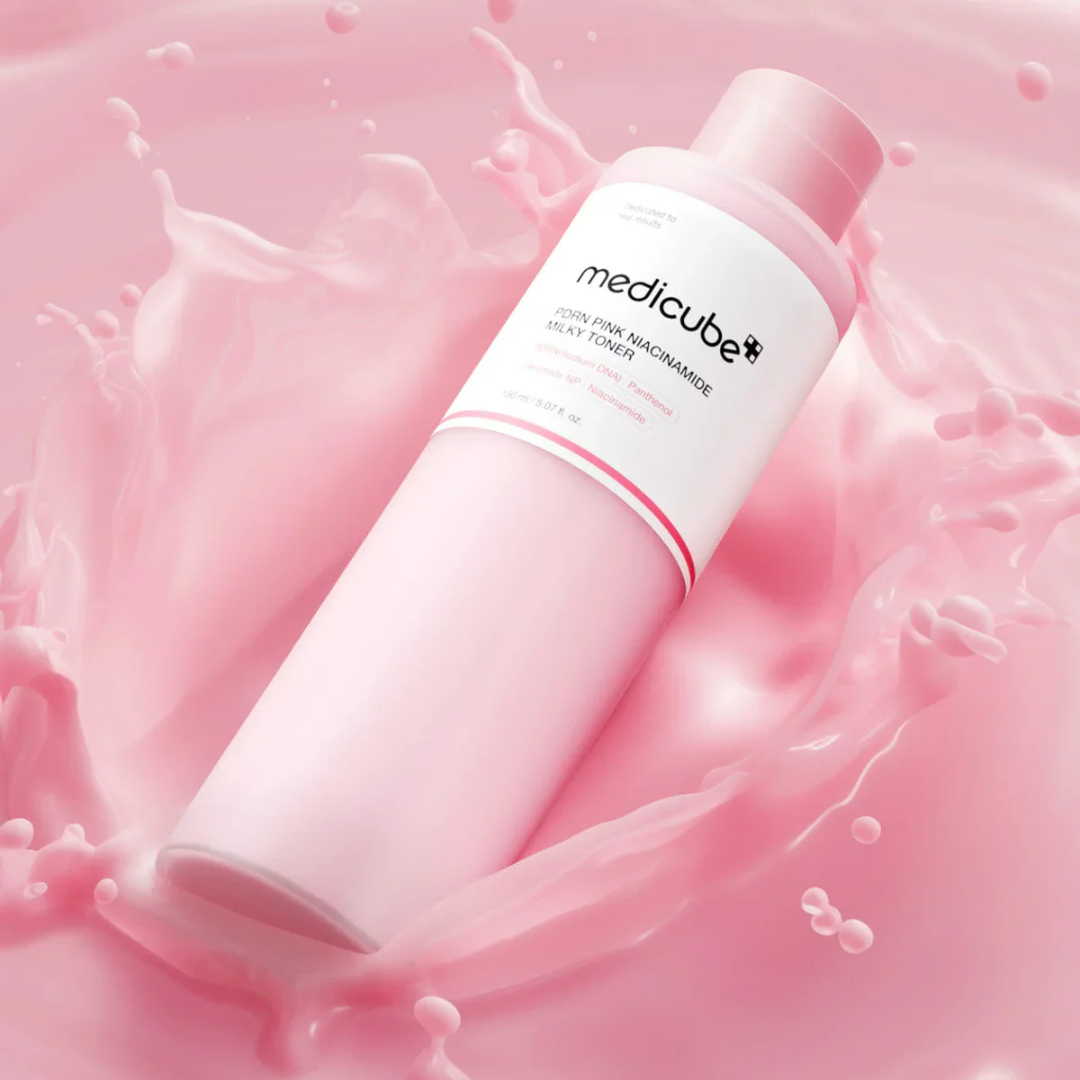 Pink skincare bottle with 'medicube' on a pink background