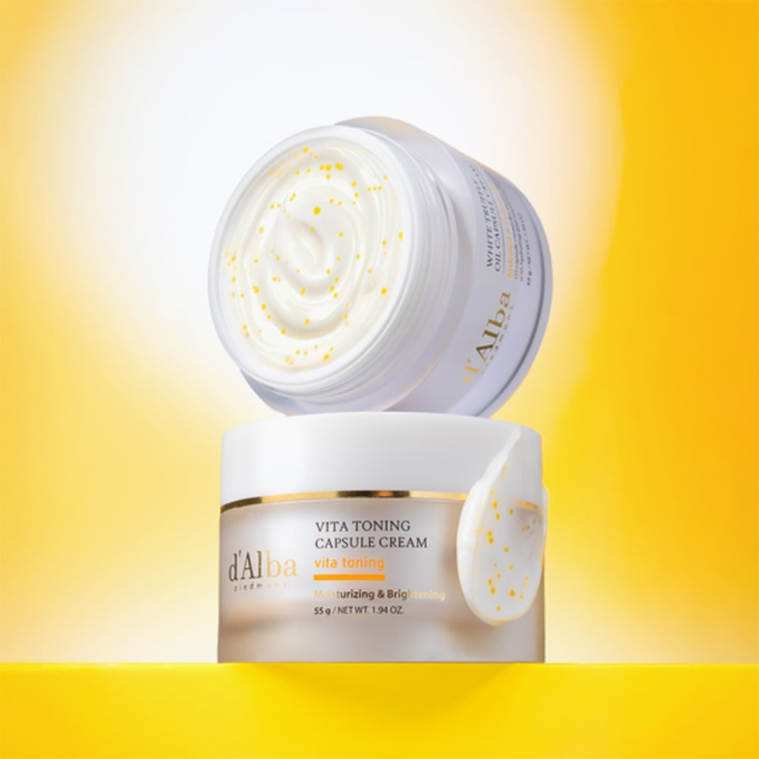 Two jars of d'Alba Vita Toning Capsule Cream on a yellow background