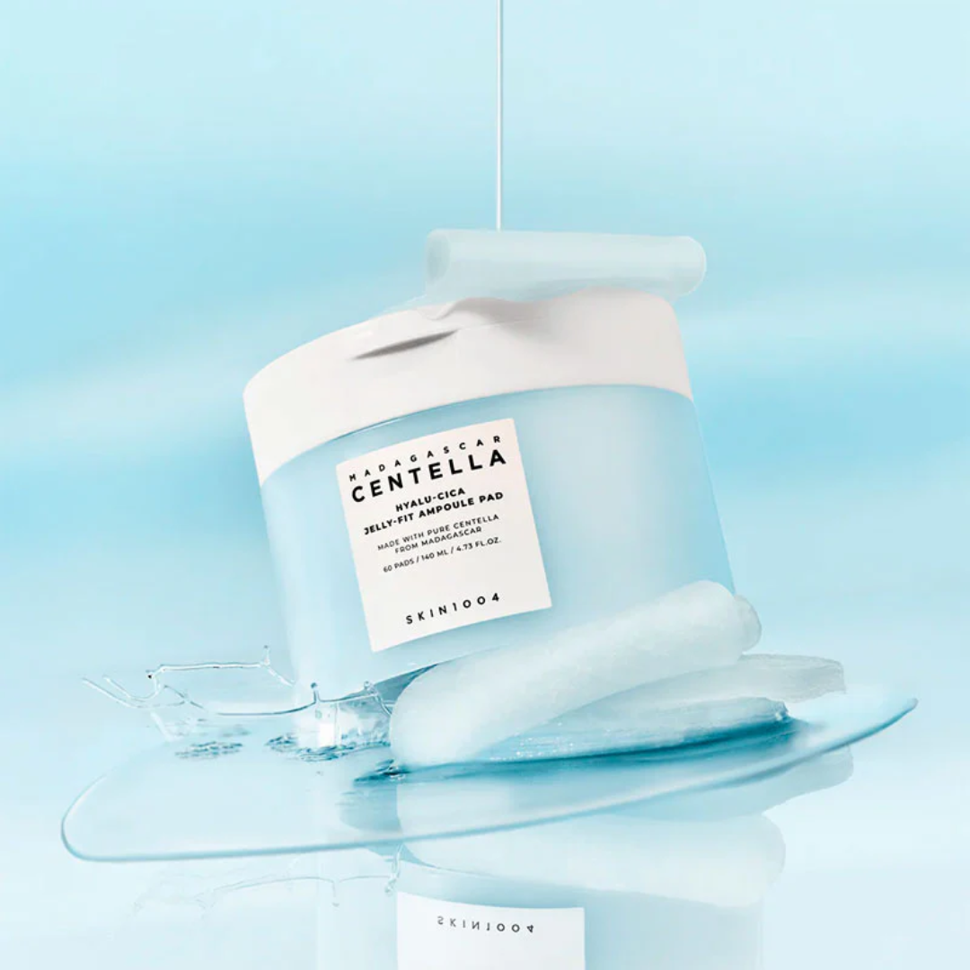 Skincare product with a label on a clear stand against a light blue background