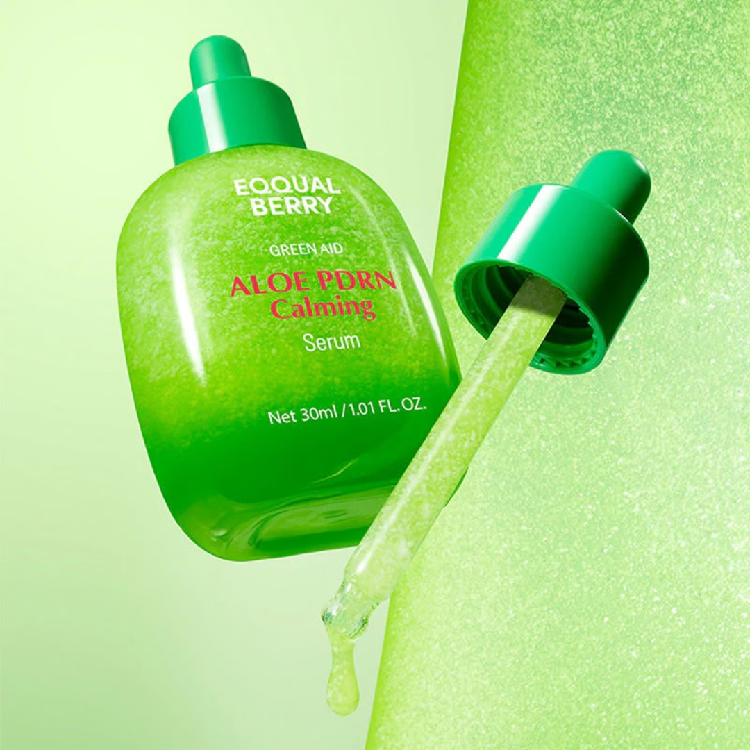 Green aloe vera serum bottle with dropper on a green background