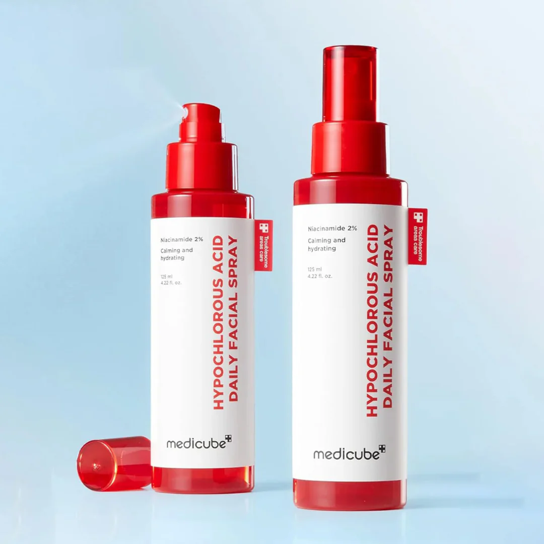 Two bottles of medicube hypochlorous acid daily facial spray on a light blue background