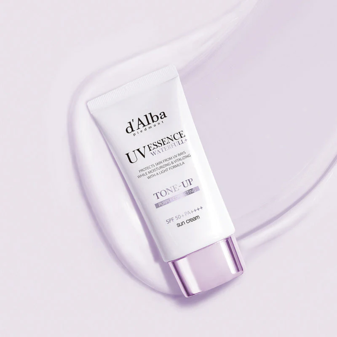 Tube of d'Alba UV Essence Waterlily Tone-Up cream on a light purple background