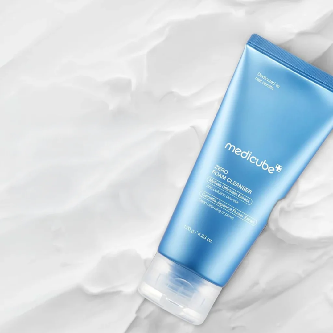 Blue tube of Medicube skincare product on a white cream background