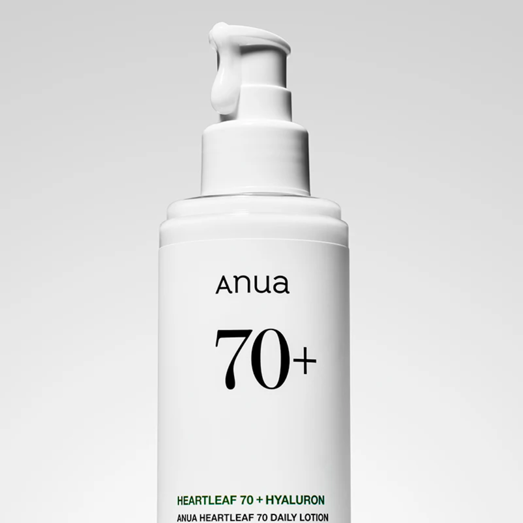 White skincare bottle labeled 'Anua 70+' on a gray background