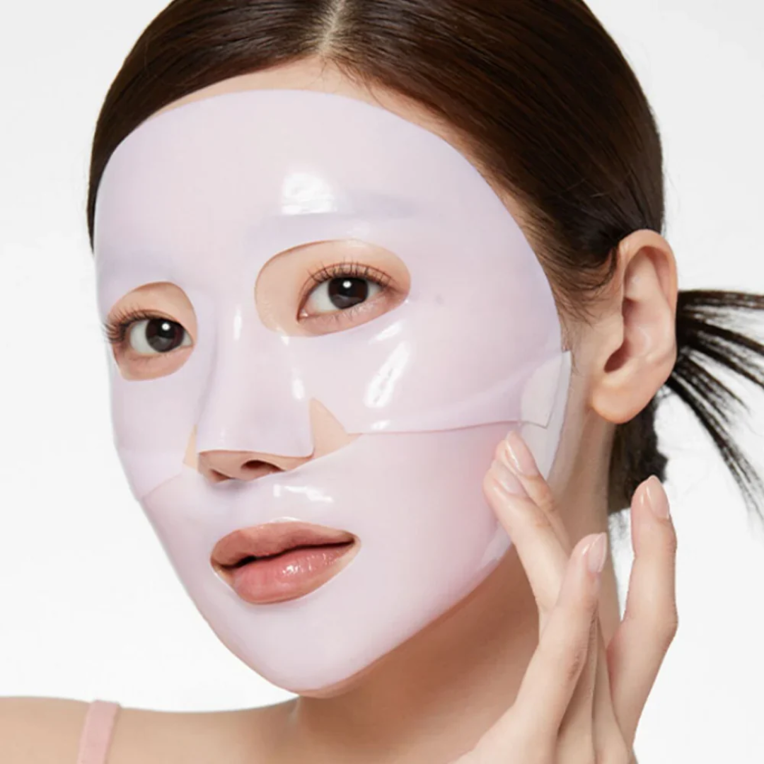 Woman wearing a pink face mask on a white background