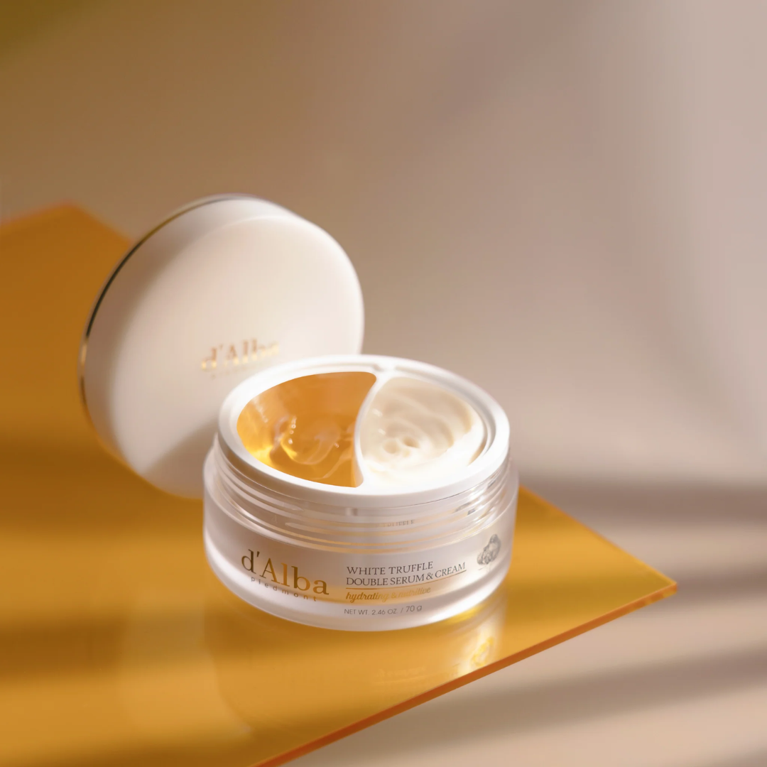 Skincare product jar with open lid on a yellow surface