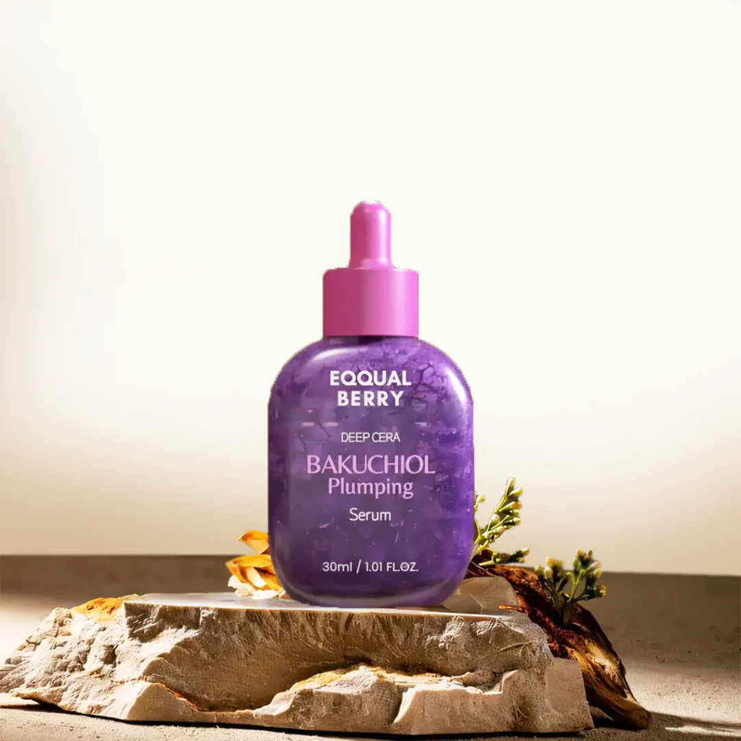 Purple skincare serum bottle with pink cap on a stone surface