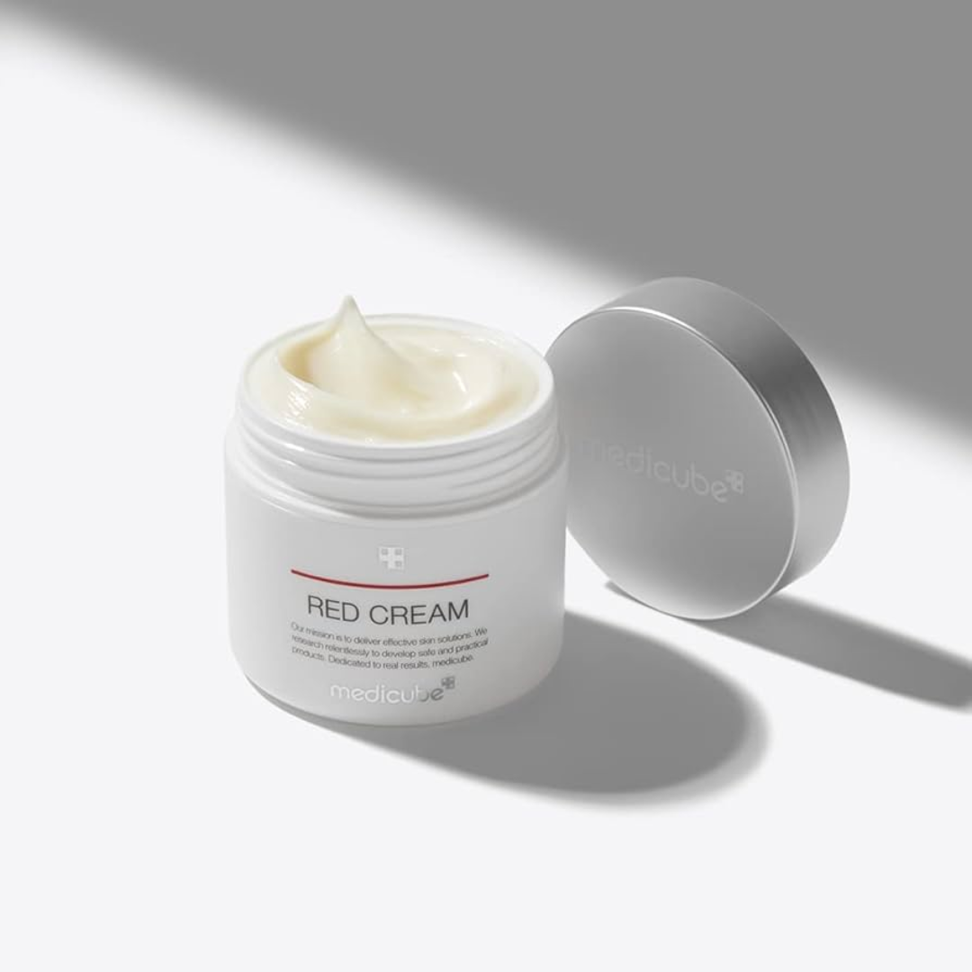 Jar of Red Cream with a white lid on a light gray background