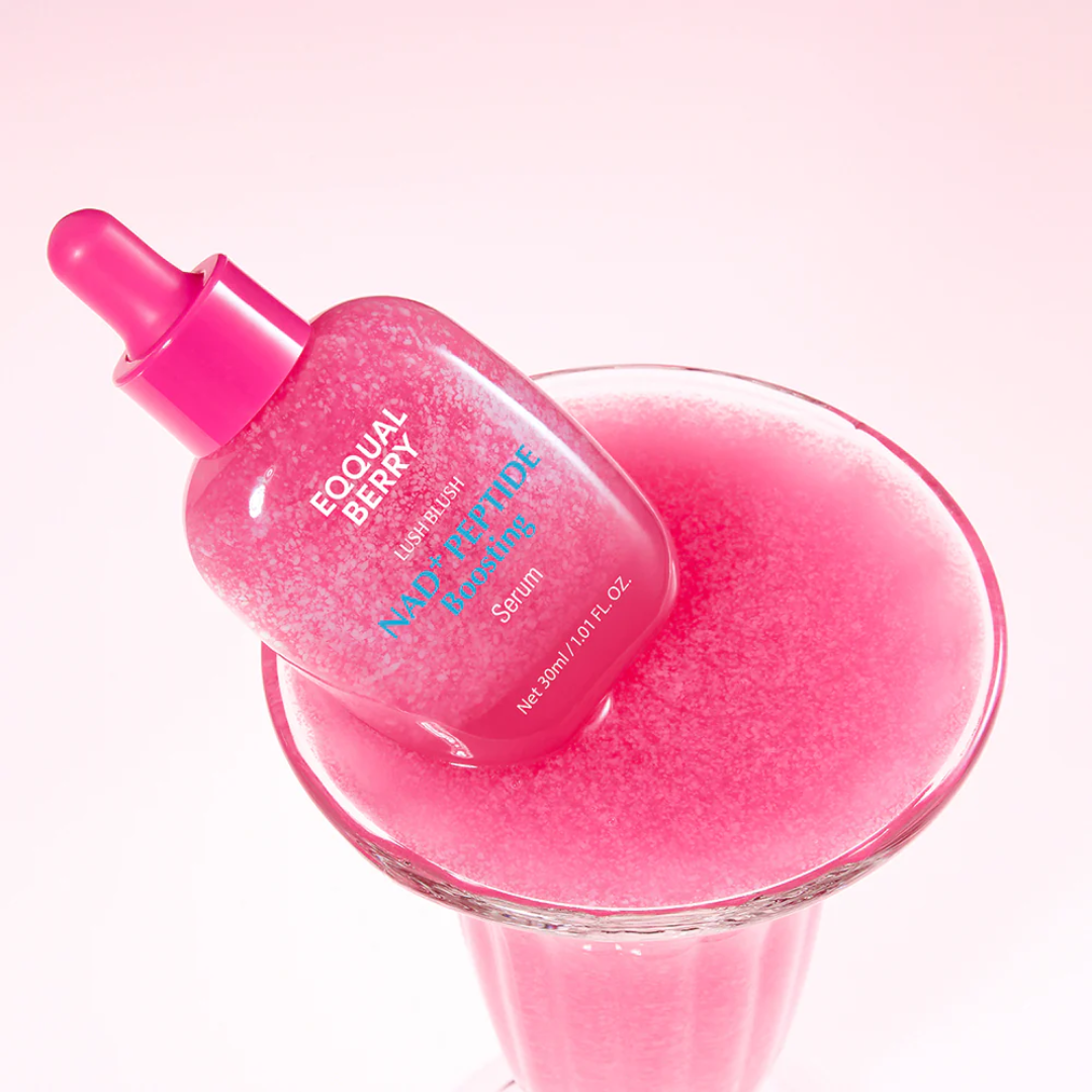 Pink skincare serum bottle with dropper on a pink background