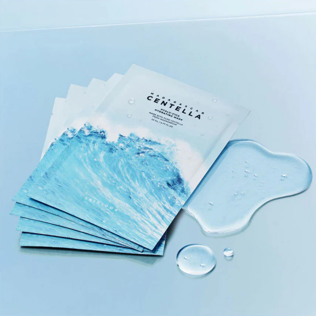 Sheet masks with Centella Asiatica on a light blue background