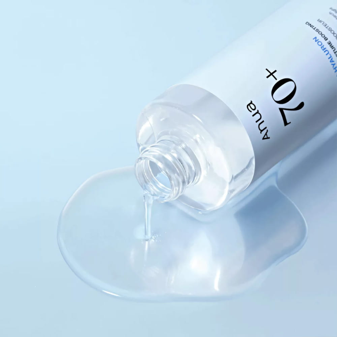 Bottle of skincare serum with dropper on a light blue background