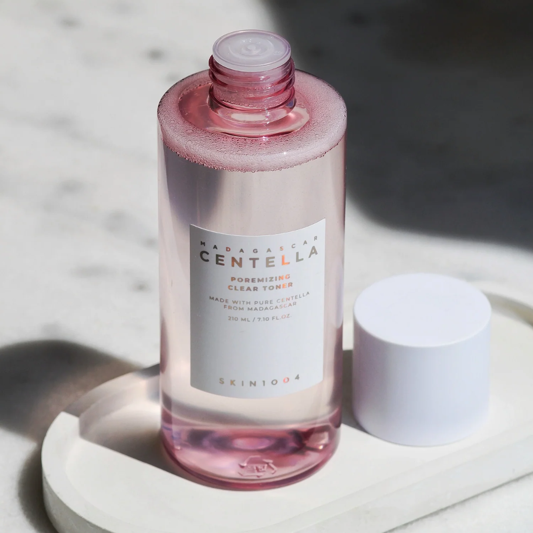 Skintouch Madagascan Centella toner bottle on a white surface with a blurred background