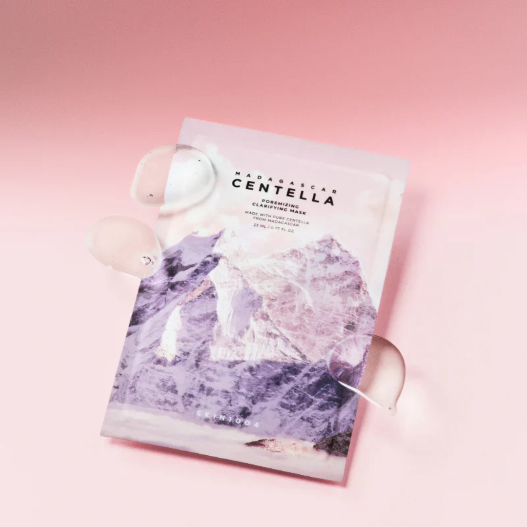 Sheet mask with purple design and 'MADARA' branding on a pink background