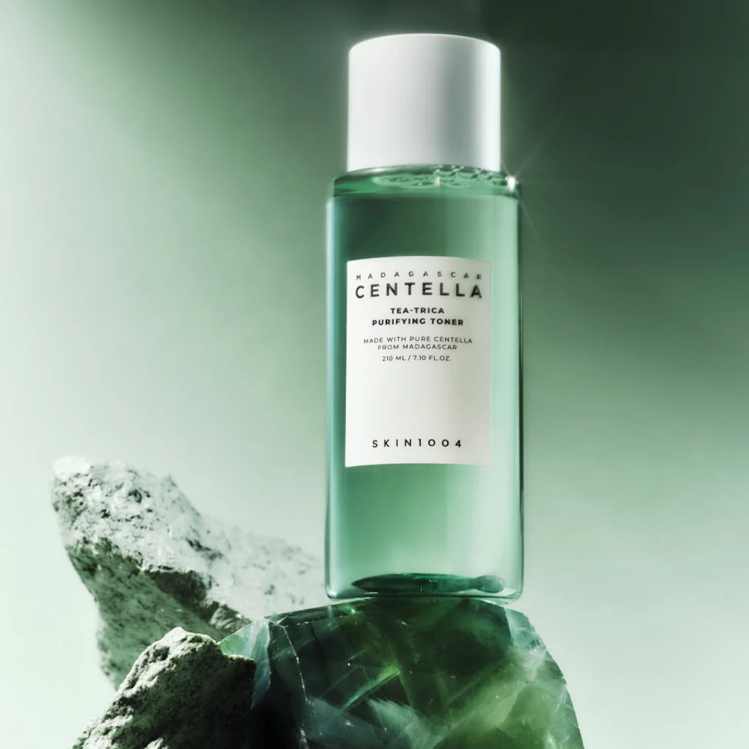 Skincare bottle with Centella label on a green background