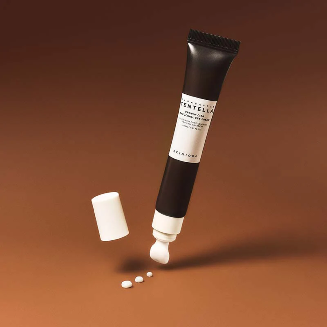 Skincare tube with cap and capsules on a brown background