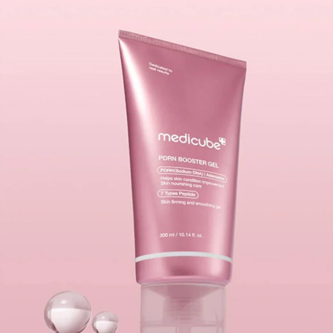 Pink tube of Medicube PDRN Booster Gel on a pink background