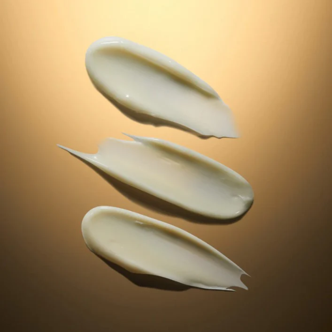 Three swatches of cream on a gold background