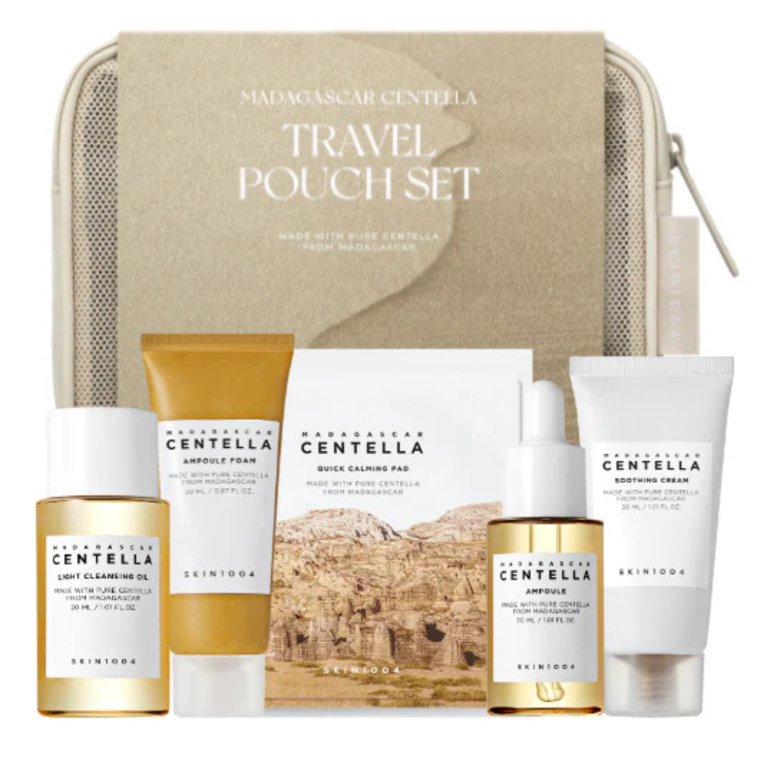 Skincare travel pouch set with various products including bottles and tubes on a beige background.