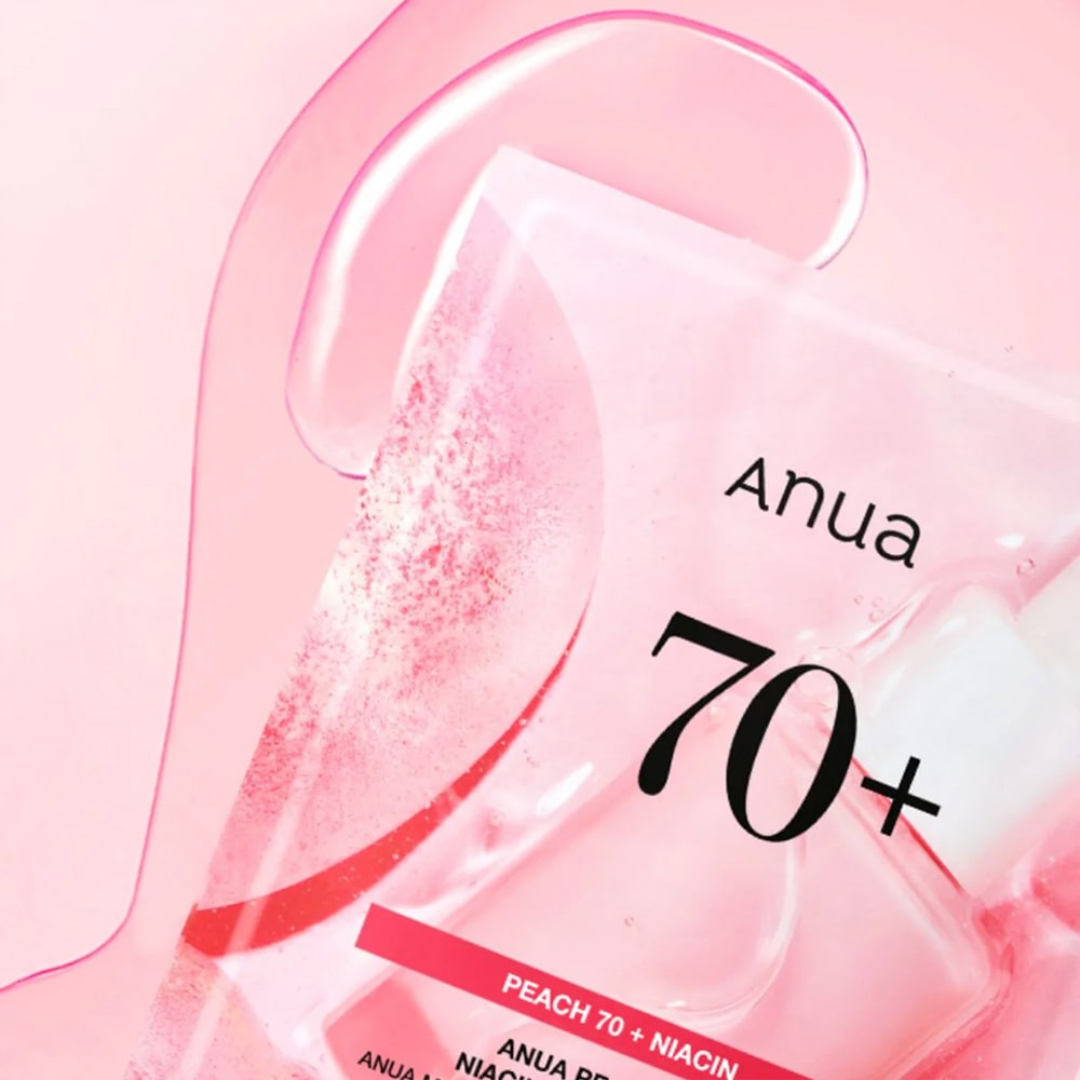 Anua skincare product packaging with '70+' on a pink background