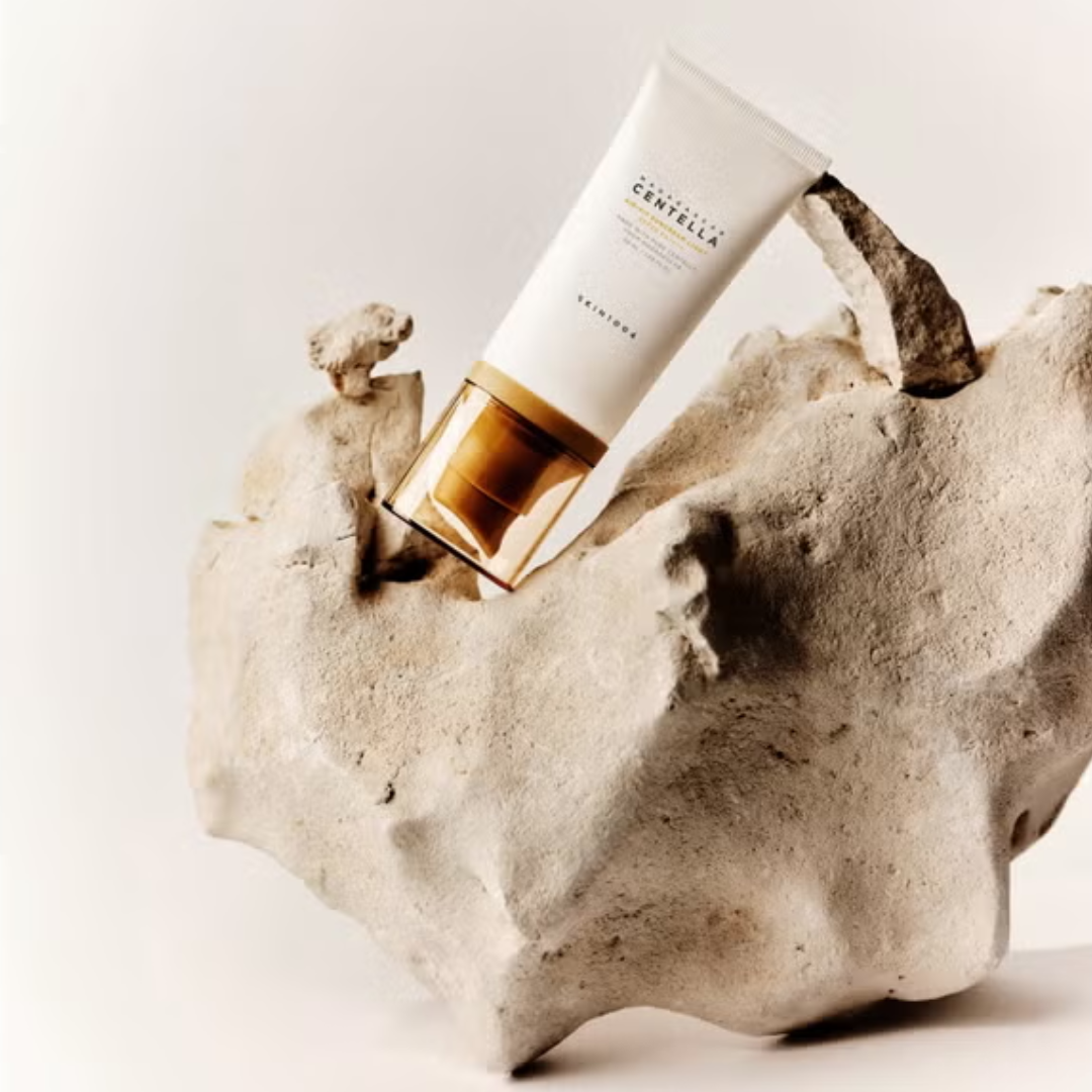 Skincare product on a natural stone surface with a neutral background