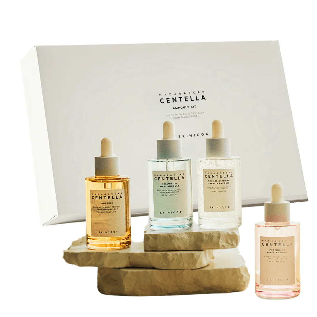 Set of skincare products with 'Madagascan Centella' branding on a wooden stand against a white background.