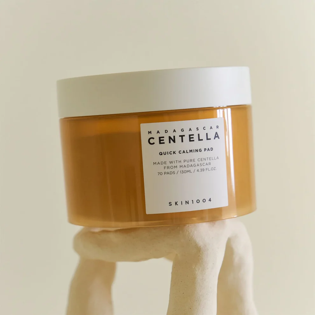 Jar of Madagascar Centella Quick Calming Pad with a white label on a beige background