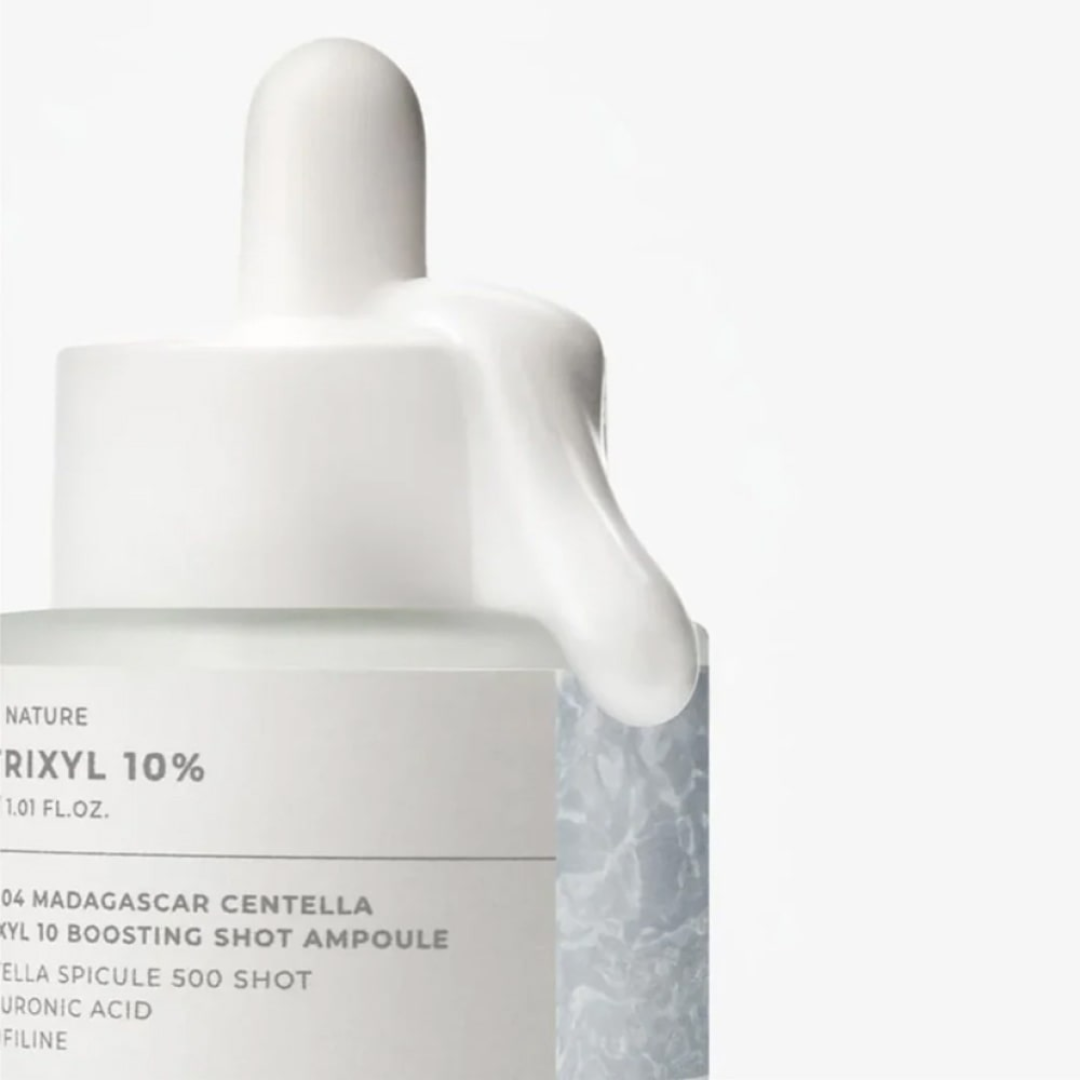 Skincare bottle with dropper labeled 'Matrixyl 10%' on a light gray background