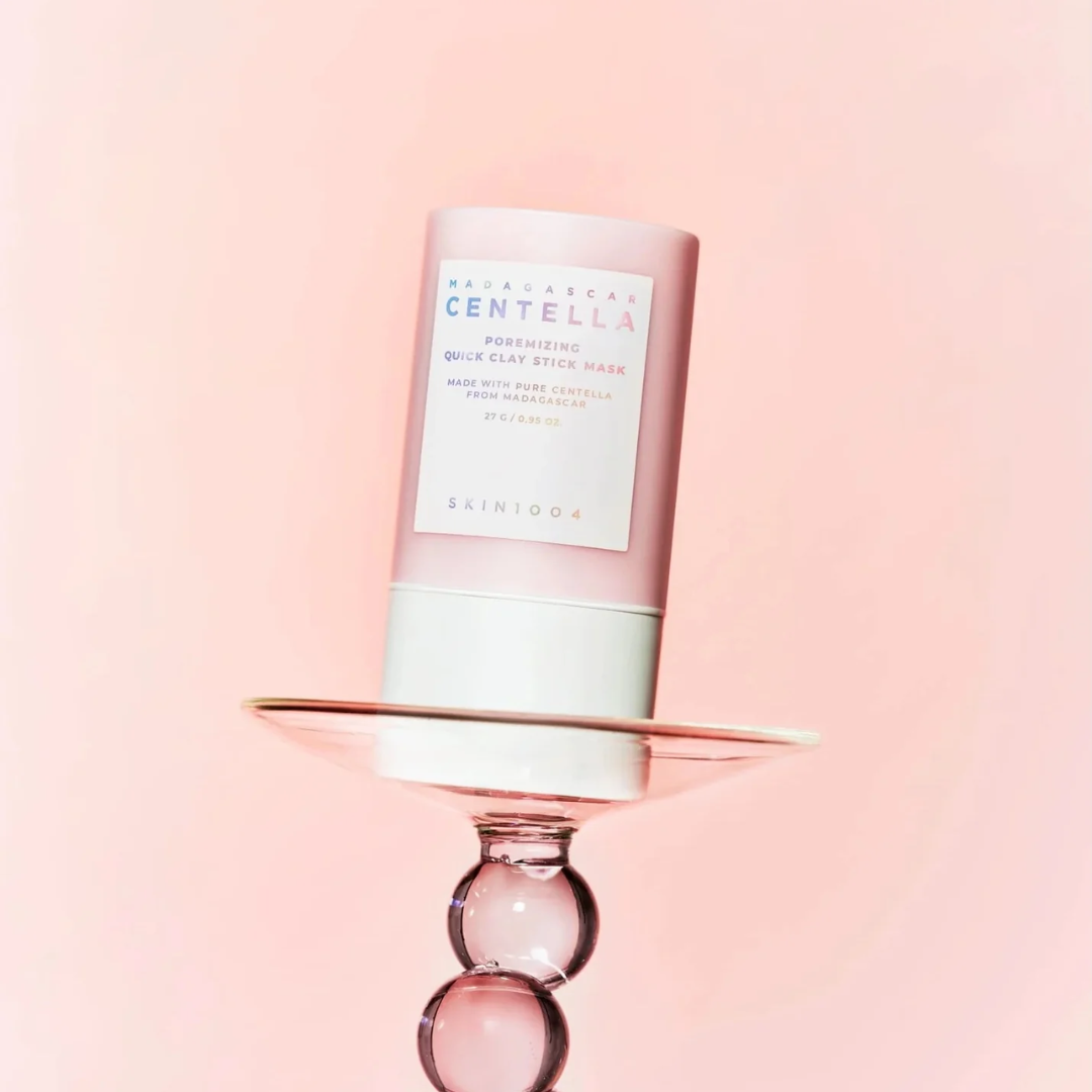 Skincare product with a pink and white design on a light pink background