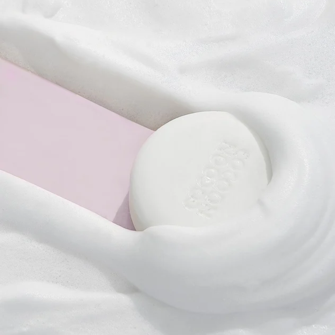 Close up of Soap bar in foam mask