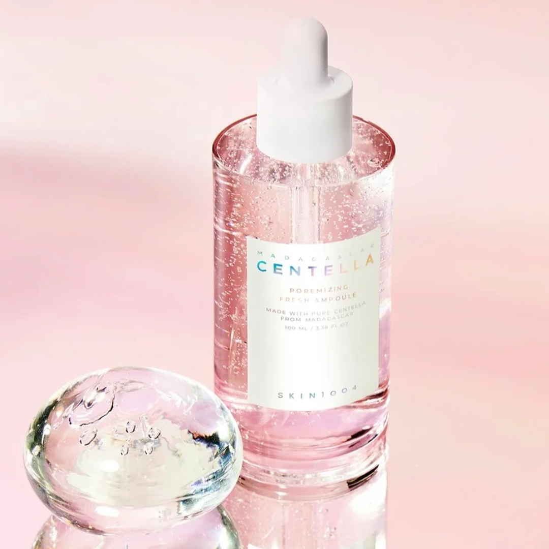 Skincare bottle with dropper labeled 'Skinceed Centella' on a pink background