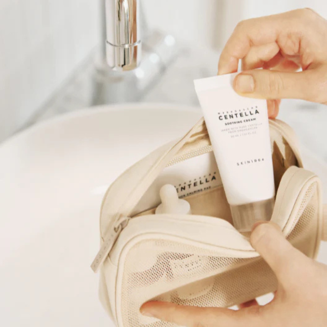 Person placing a skincare product into a beige mesh bag with a neutral background