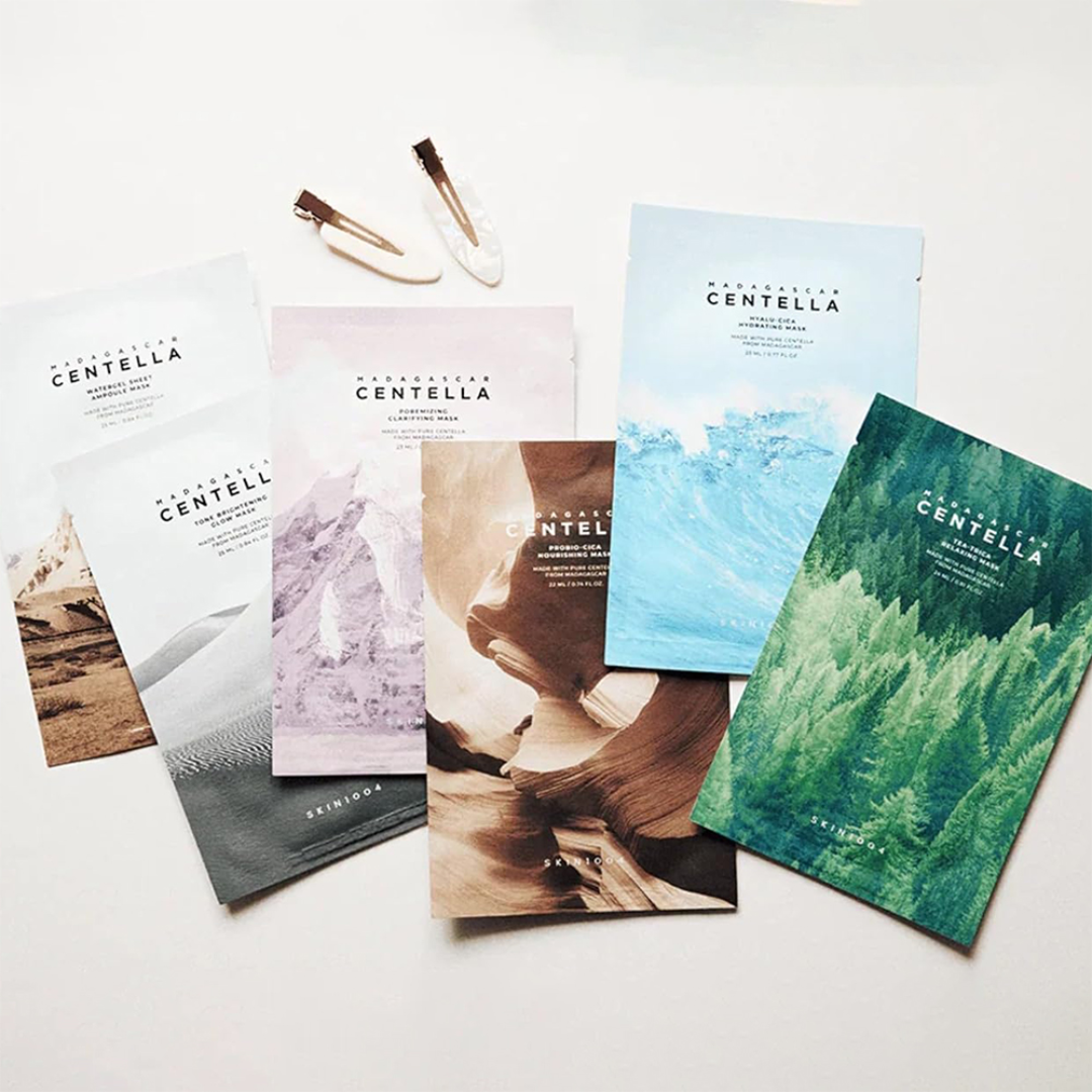 six masks with nature-themed designs on a white surfaces
