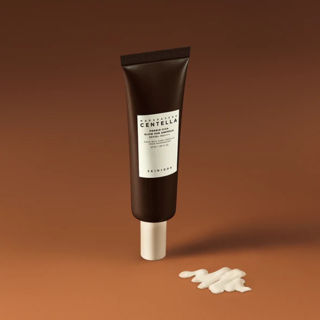 Skincare tube with white cream on a brown background
