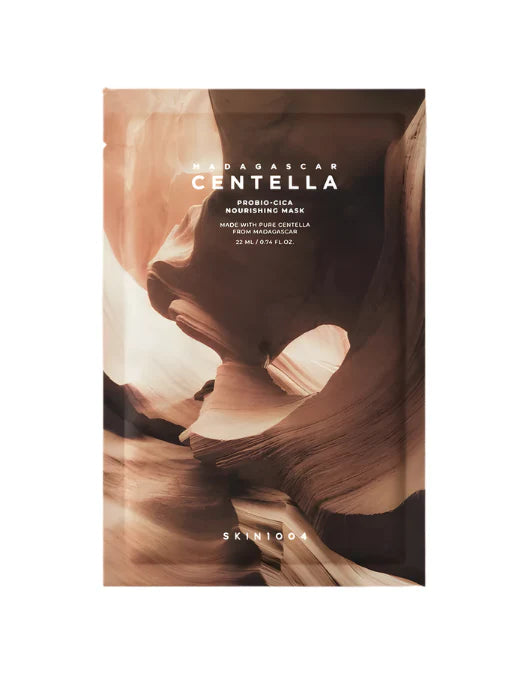 Skincare mask packaging with a desert landscape design and 'SKINICOLA' branding.