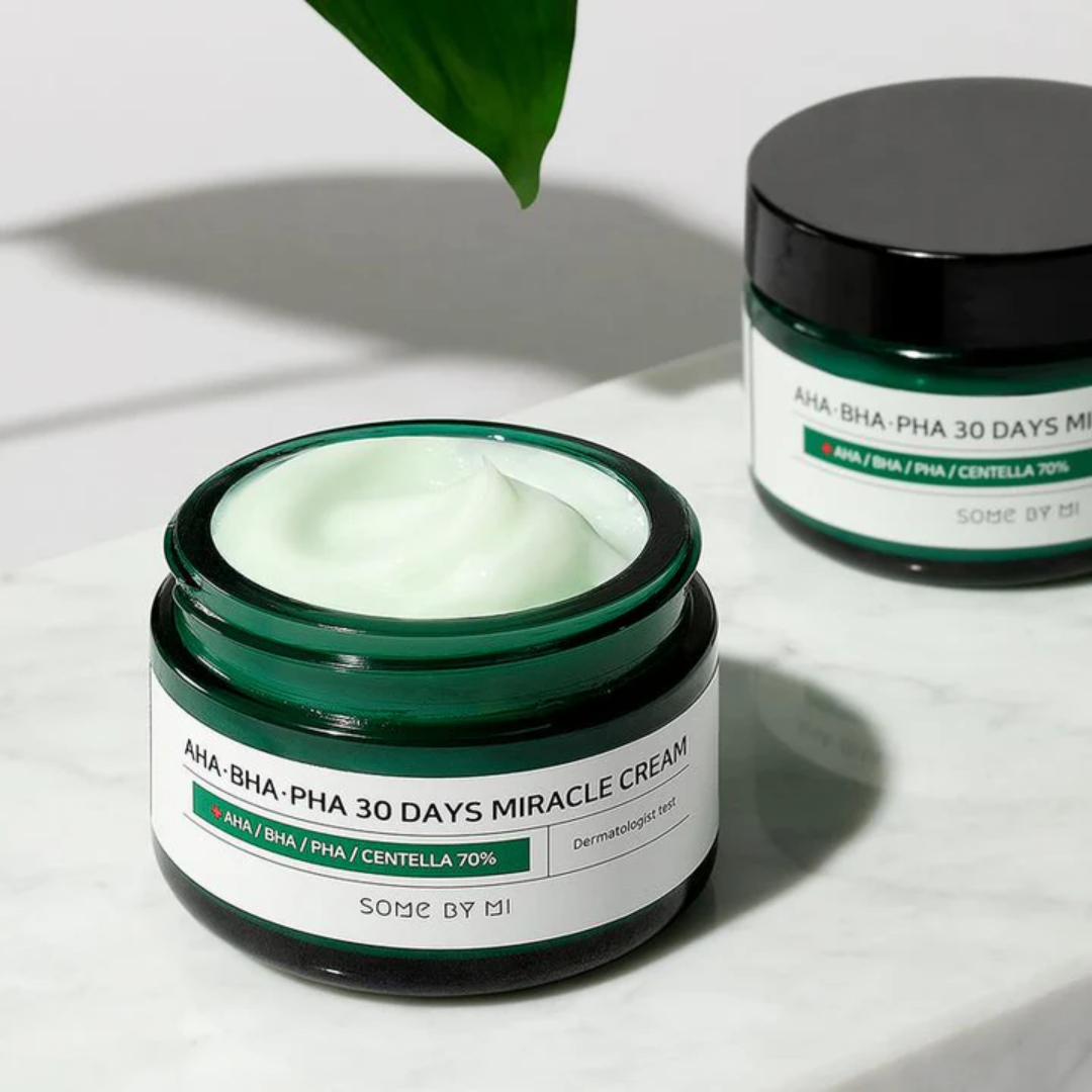 Two jars of 'AHA BHA PHA 30 Days Miracle Cream' by Some By Mi on a light background.