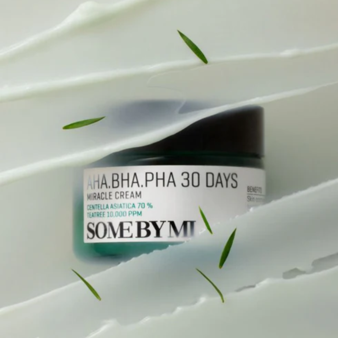 Skincare cream jar labeled 'Some by Mi' on a white background with green leaves.