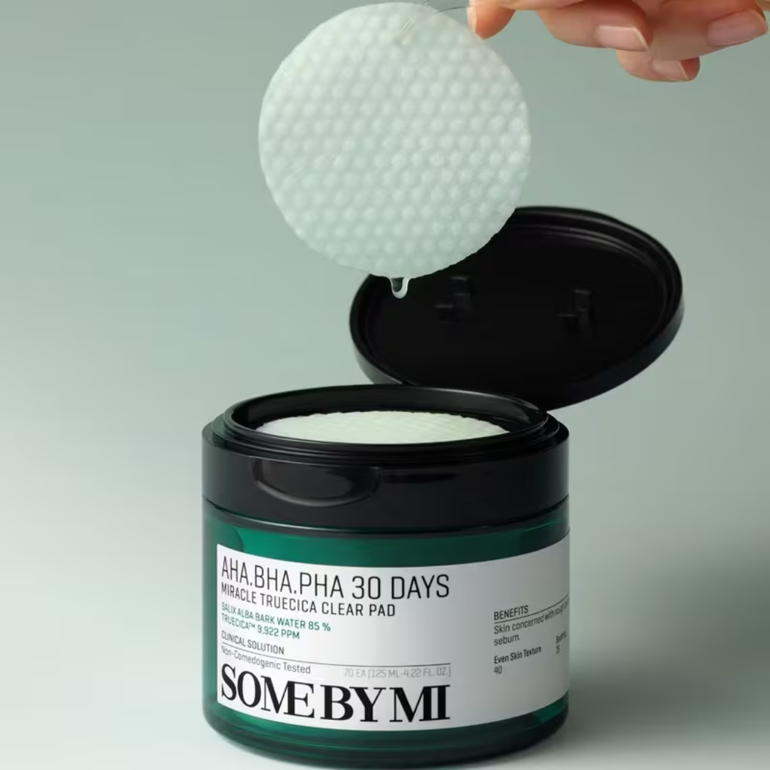 SomeByMi skincare product with a clear pad being taken out