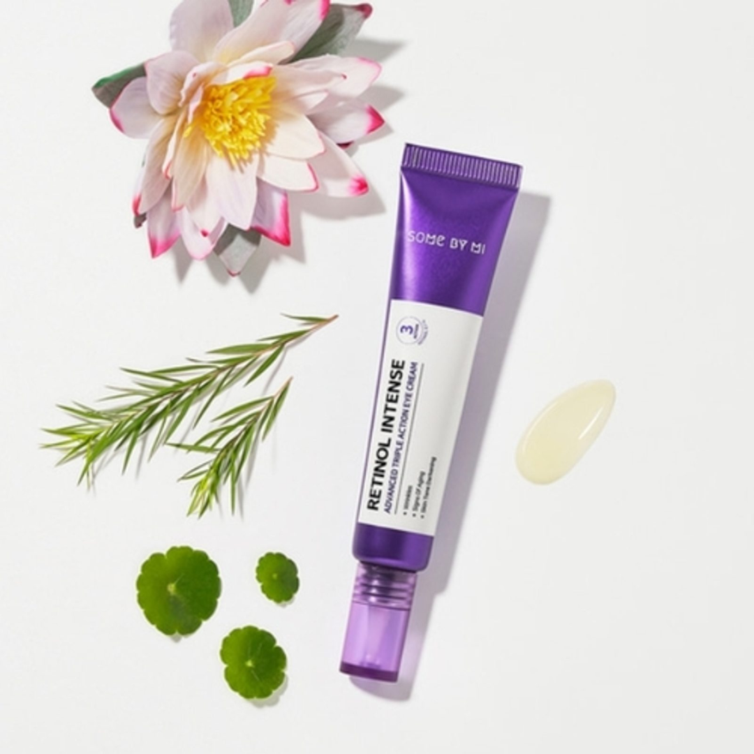 Purple skincare tube with floral and green leaf elements on a white background