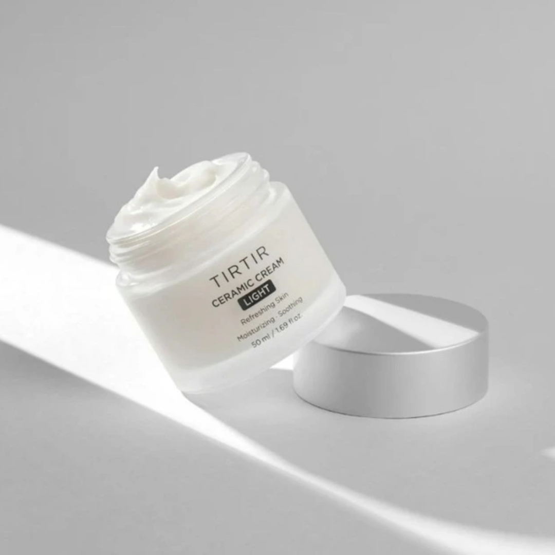White ceramic cream jar with TIRTIR branding on a gray background