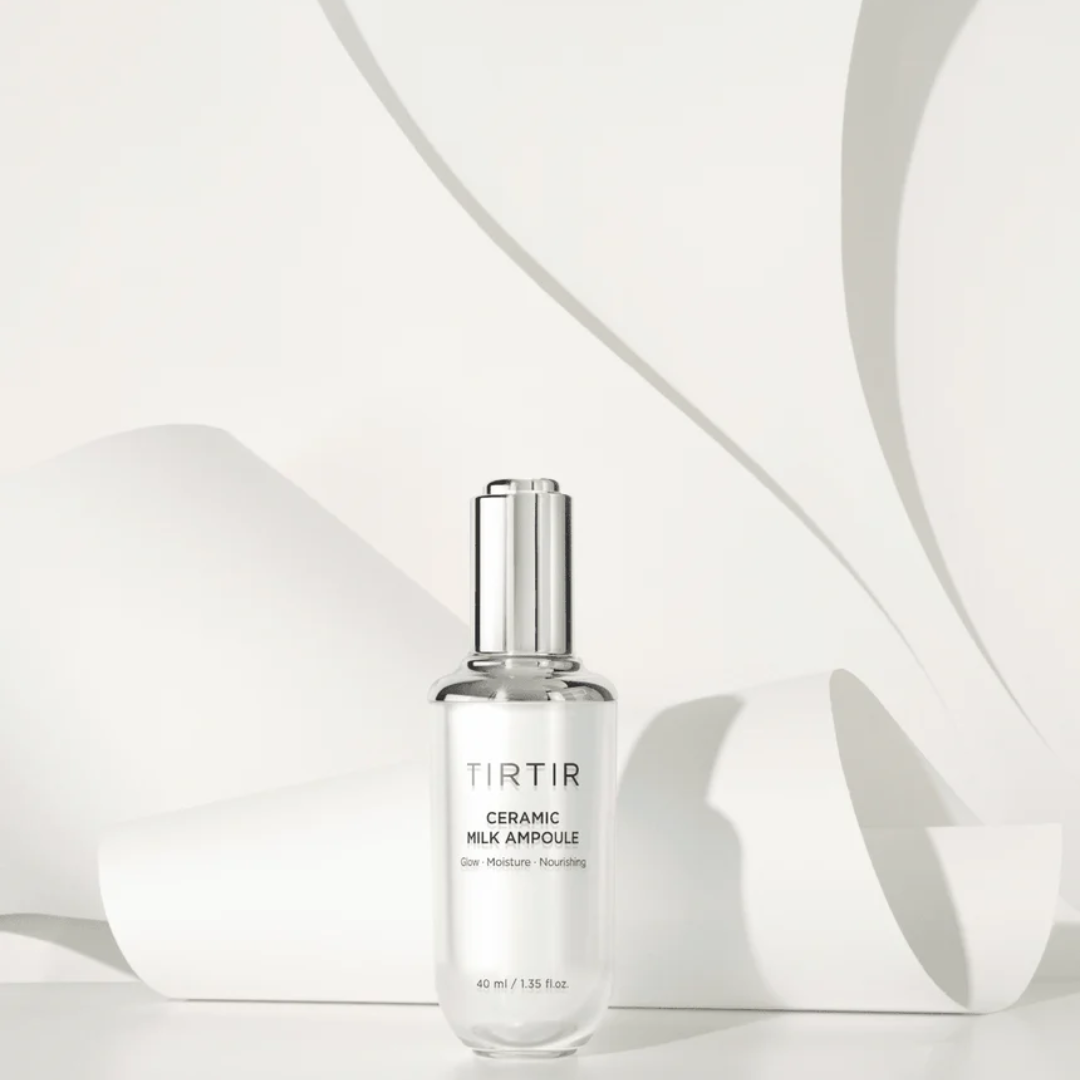 Ceramic milk ampoise bottle with TIRTIR branding on a white background