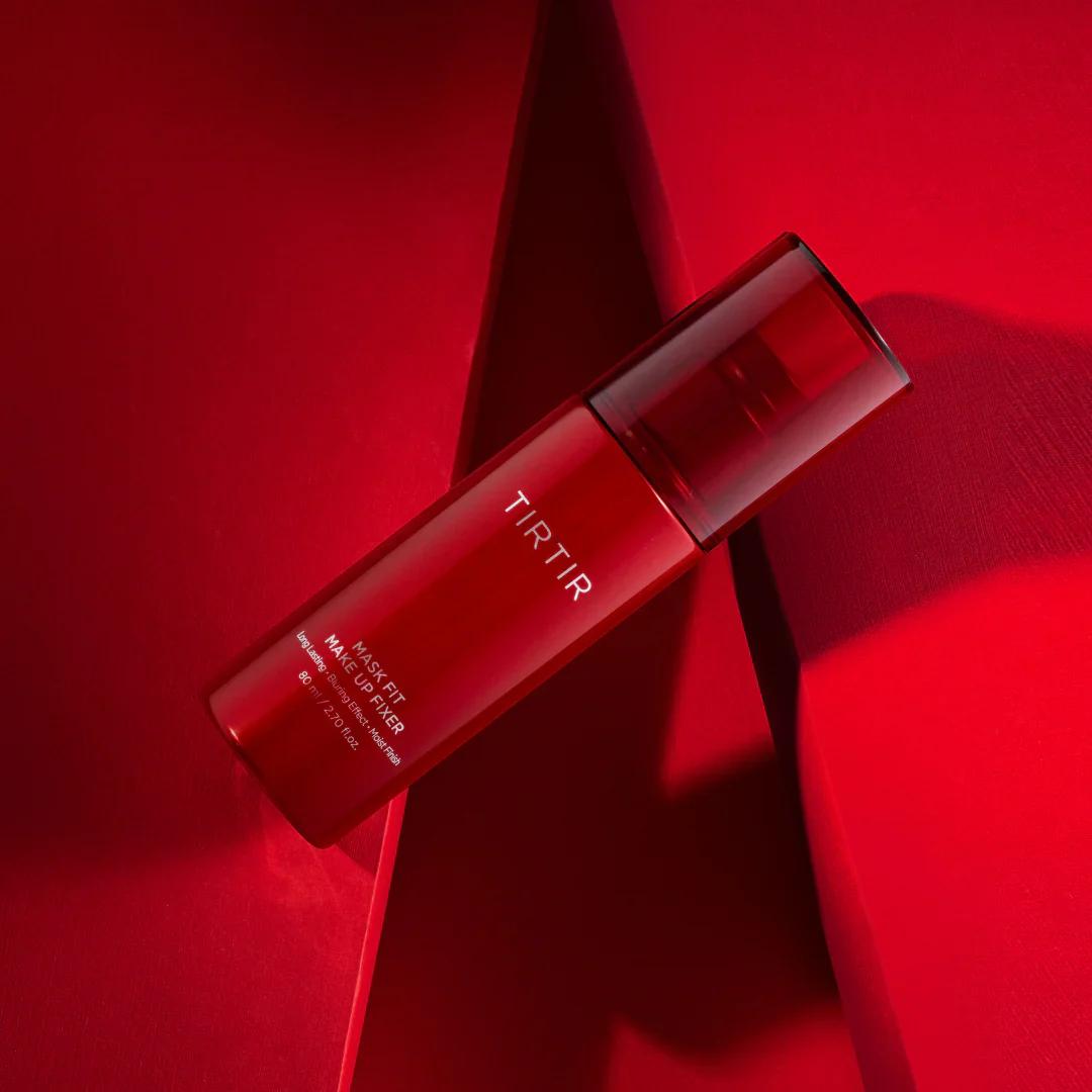 Red TIRTIR skincare bottle on a red background