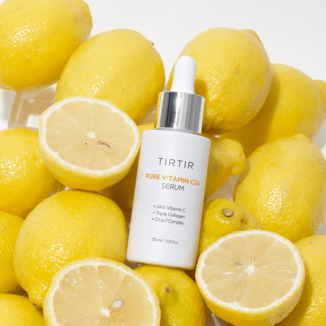 TIRTIR Pure Vitamin C Serum bottle surrounded by lemons on a white background